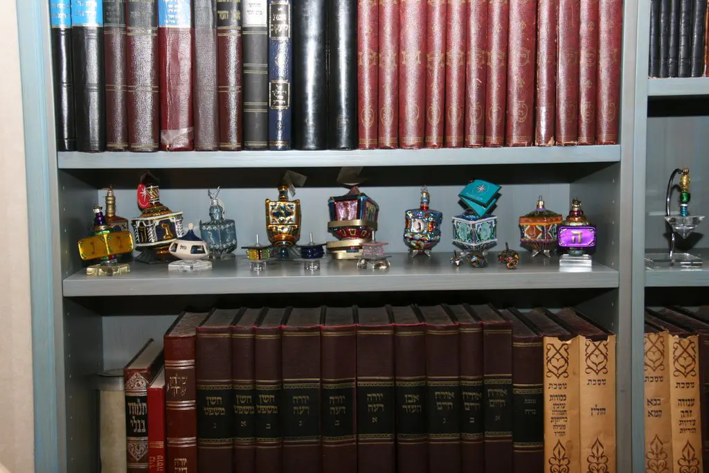 Dreidels tucked between holy books