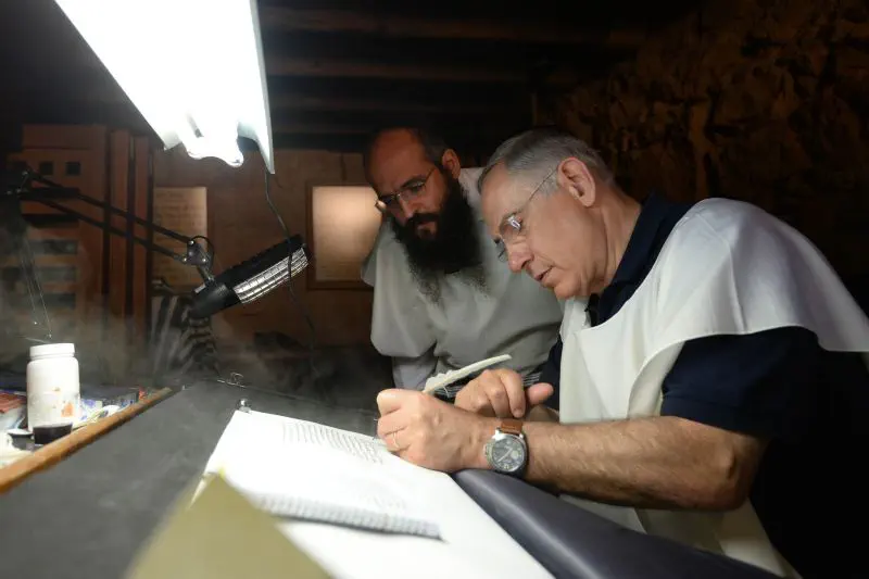 PM Netanyahu scribes letter in Torah