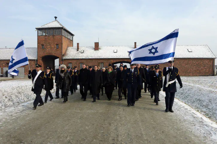 Knesset MKs march through Auschwitz