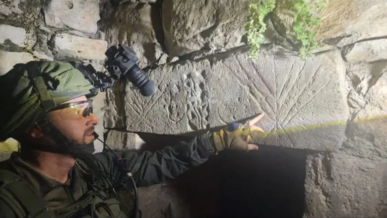 Courtesy of the photographer In Arab village: IDF soldiers discover ancient menorah engraving