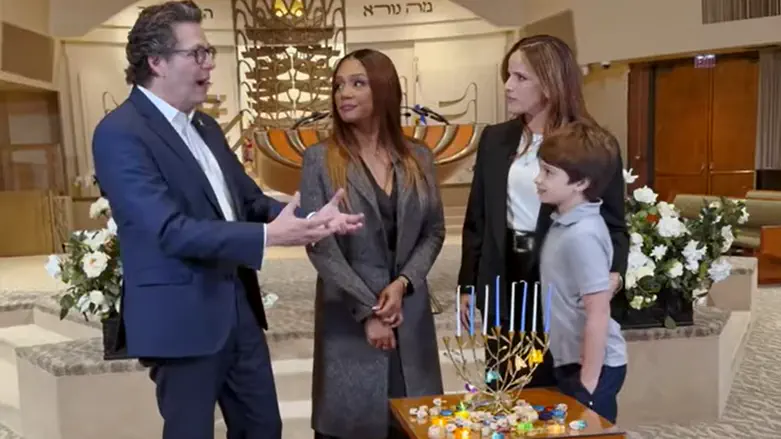 Tiffany Haddish and Noa Tishby light Hanukkah candles