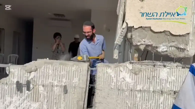 Photograph: Hero who lost both hands fighting to save his family returns home