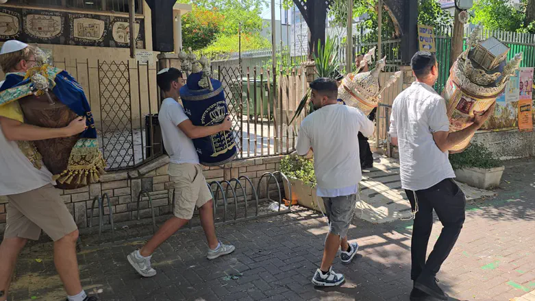 Torah scrolls rescued from synagogue hit in missile strike
