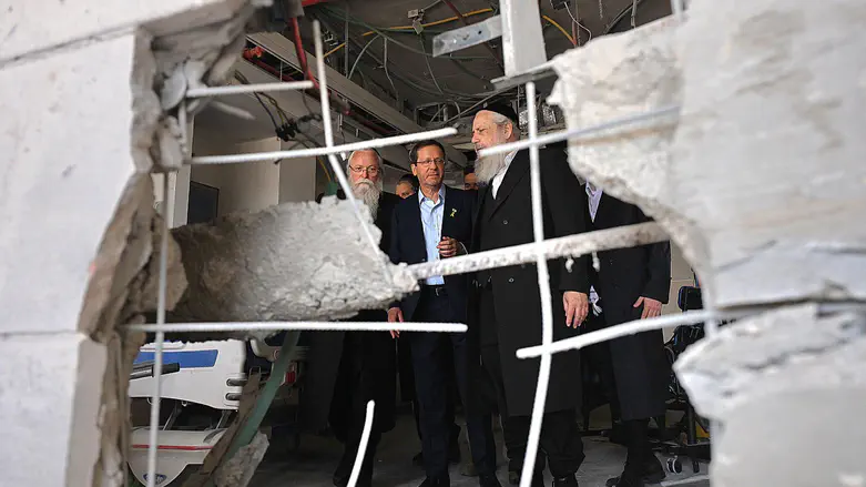 Herzog visits missile strike sites: 'This place will be rebuilt'