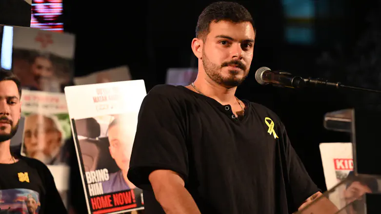 Omer Wenkert speaking at a demonstration