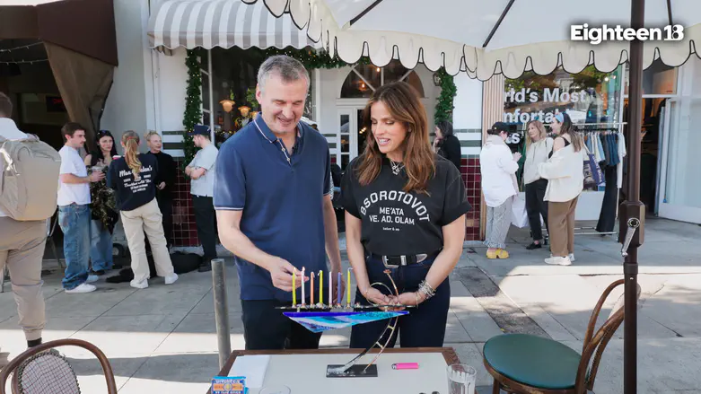 Watch: Noa Tishby lights Hanukkah candles with writer and producer Phil Rosenthal