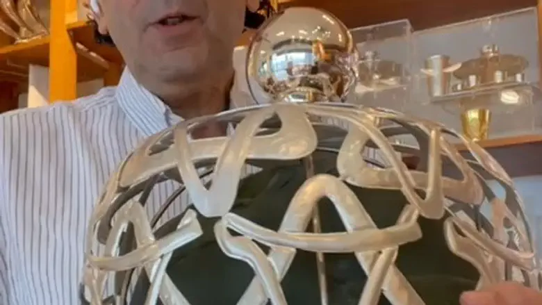 Torah scroll in memory of fallen soldier adorned with his helmet