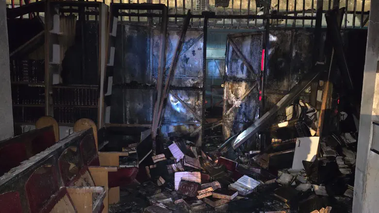 Suspected arson: Torah scrolls rescued from the flames