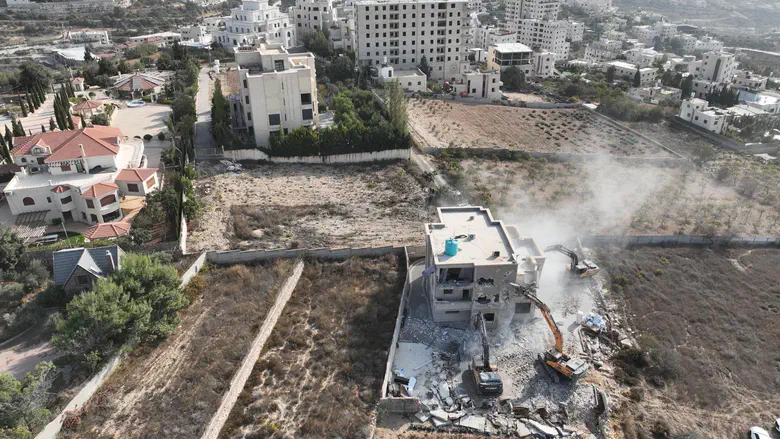 Bulldozers in operation on the outskirts of Hebron