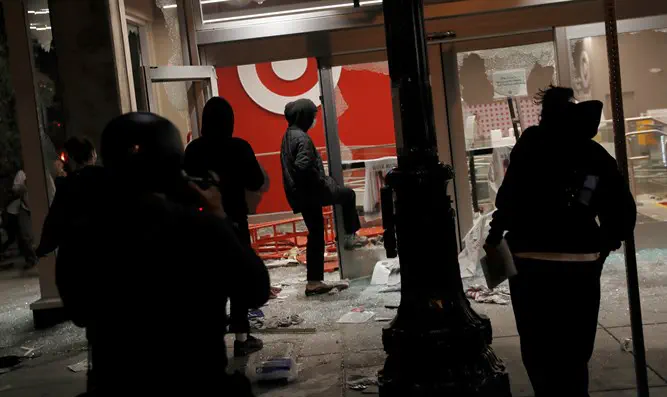 REUTERS/Stephen Lam What connects Kristallnacht to the riots on America?