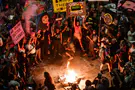 Hostage's relative detained, protesters surround police car