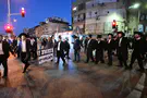 Haredim block Bnei Brak streets to protest draft
