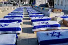 Bereaved families set up display of coffins in Jerusalem
