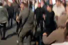 Police officer stomps on protester's head
