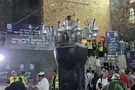 Watch: Ancient and new meet as thousands visit Rabbi Meir's grave