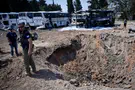 Bedouins steal fuel from buses damaged by missile