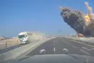 Missile falls meters from moving vehicle