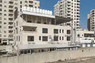 Illegal building becomes part of security barrier