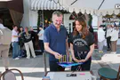Noa Tishby lights Hanukkah candles with producer Phil Rosenthal