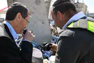 Haim Zach/GPO Herzog kisses tefillin that survived Beit Shemesh missile strike