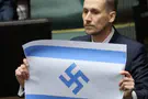 Polish MP displays Israeli flag with a swastika
