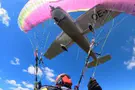 Light aircraft collides with paraglider