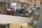 Watch: Police chase suspect through crowded mall