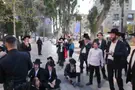 Protesters swarm haredi soldier, shout: "Traitor"