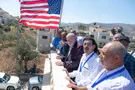 Huckabee pulled out his phone and filmed Jewish settlers