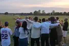 Kesher Yehudi Nova survivors and freed hostages dance at Auschwitz