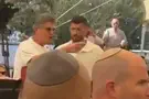 צילום: ערוץ 7 Memorial ceremony erupts as bereaved father heckles Netanyahu