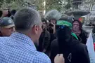 screenshot Man rips mask off protester’s face in New York