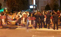 Demonstrators protest outside home of top justice official
