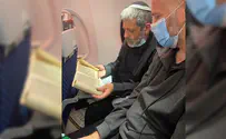 A very special Megillah reading on an airplane headed for Ukraine