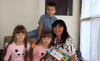 New immigrants going into 1st grade receive new school supplies