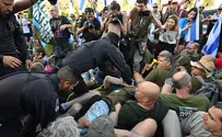 Protesters clash with police outside Justice Minister's home
