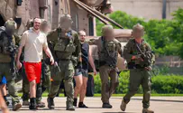 Freed hostages evacuated under fire
