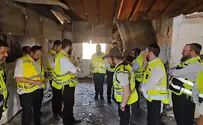 ZAKA volunteers read Kaddish prayer in home of slaughtered family