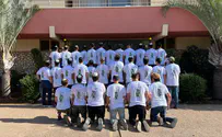 Students wear shirts in memory of teacher who fell in battle