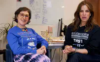 Mayim Bialik and Noa Tishby light Hanukkah candles