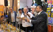 Father of hostage lights menorah