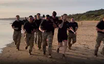 Defense Sec. Hegseth leads morning workout on Omaha Beach