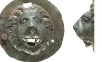 Rare bronze lion head discs found in archaeological excavation