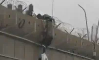 Illegal residents climb over wall near Atarot