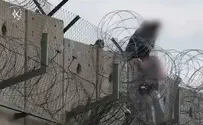 צילום: דוברות המשטרה Shocking footage: Infiltrator passes girl over security wall