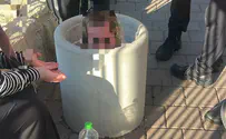 Game turns serious: Child finds himself stuck in concrete bin