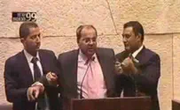 Arab MK Tibi Forcibly Removed from Podium