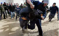 Israel news photo: Flash 90 Police to Compensate Man who Was Beaten in Amona