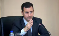 AFP photo 'Assad Has Chemicals that Can Eradicate Entire Towns'