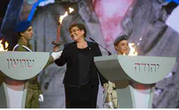 Bereaved Mother Lights Torch in Honor of Fallen Sons